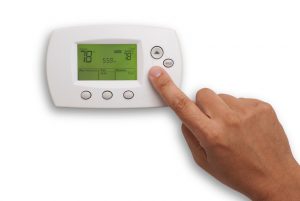 digital-thermostat-hand